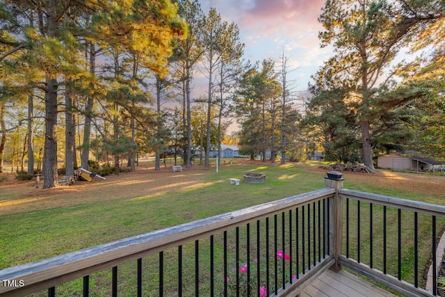 deck at dusk with a lawn