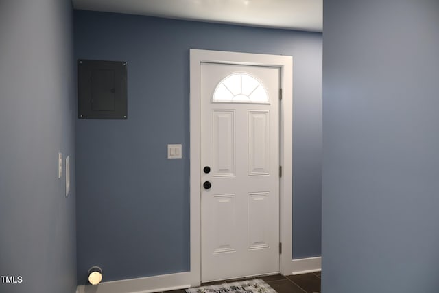 foyer entrance with electric panel and dark wood-type flooring