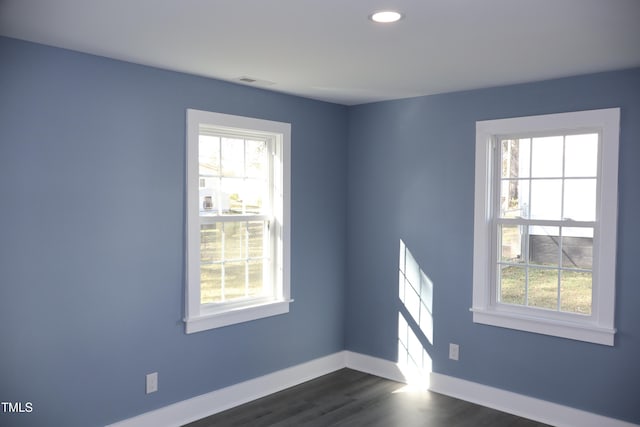 unfurnished room featuring dark wood-type flooring