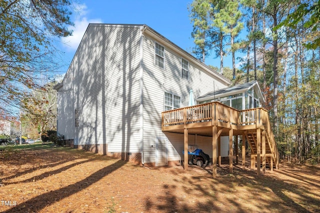 104 Full Moon Ct, Garner, NC 27529 - rear view of property with a sunroom, a deck, and stairway