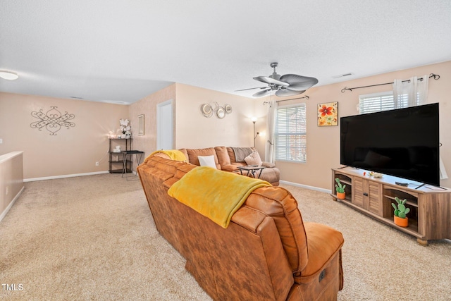 living room with ceiling fan and light carpet