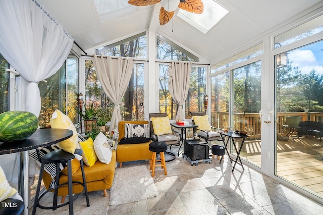 sunroom / solarium with ceiling fan and vaulted ceiling