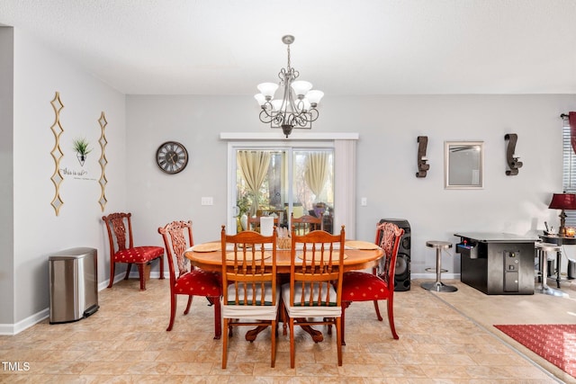 dining space featuring a chandelier