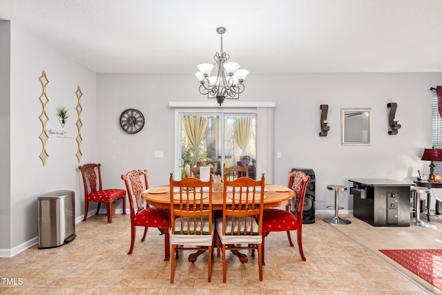 104 Full Moon Ct, Garner, NC 27529 - dining area with a chandelier and baseboards