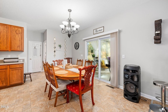 104 Full Moon Ct, Garner, NC 27529 - dining room with a chandelier and baseboards