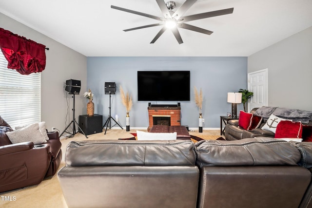 carpeted living room with ceiling fan and a fireplace