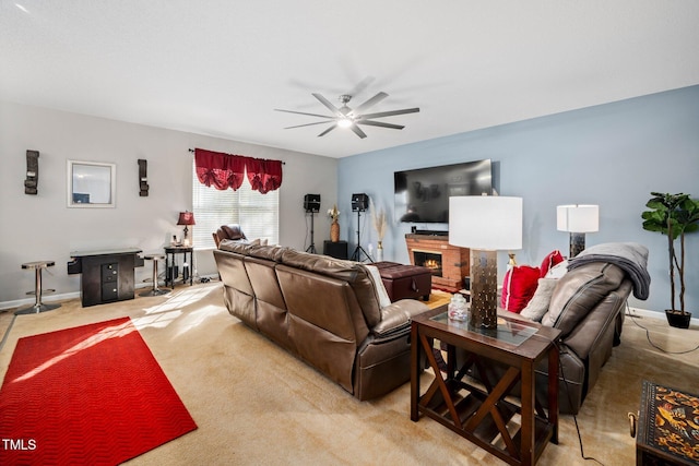 104 Full Moon Ct, Garner, NC 27529 - living area featuring ceiling fan, a lit fireplace, baseboards, and light colored carpet