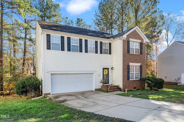 view of front of home with a front yard and a garage