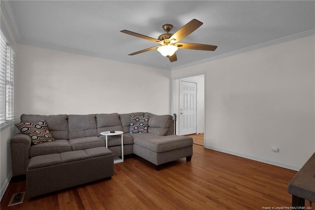 living room featuring ceiling fan, hardwood / wood-style floors, and crown molding