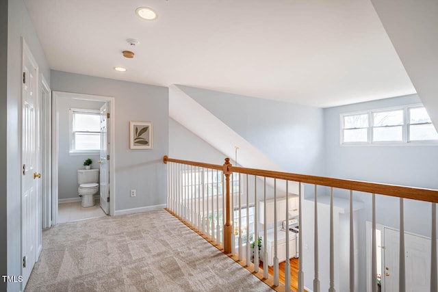 hallway with light carpet