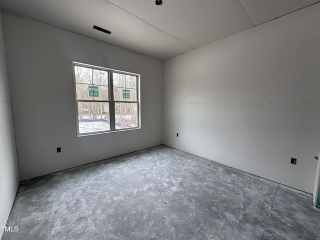 empty room featuring concrete flooring