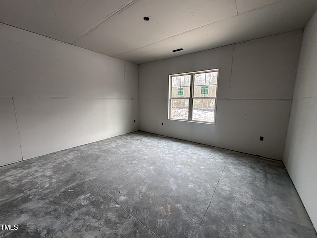 empty room featuring concrete flooring