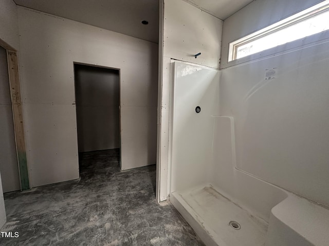 bathroom with concrete flooring