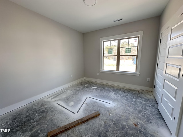 empty room featuring visible vents and baseboards