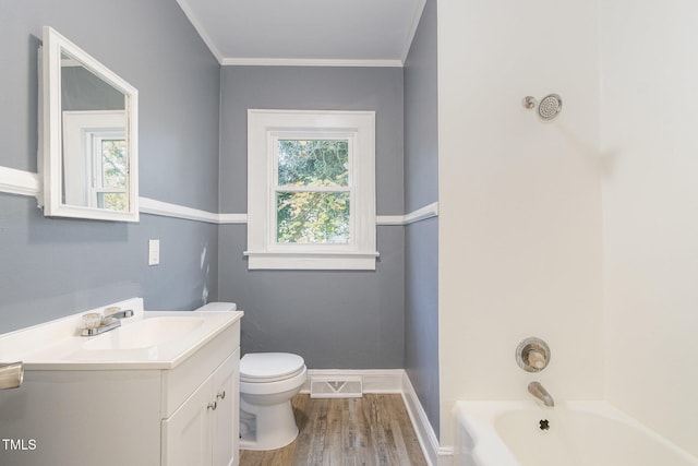 bathroom with vanity, toilet, wood-type flooring, and ornamental molding