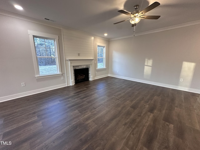 unfurnished living room with dark hardwood / wood-style floors, ceiling fan, and crown molding