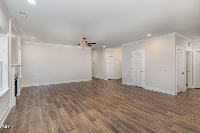 unfurnished living room featuring dark hardwood / wood-style flooring, crown molding, and ceiling fan