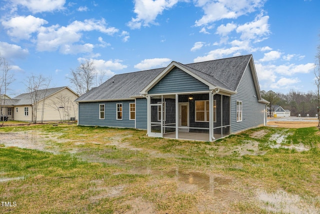 back of house featuring a sunroom