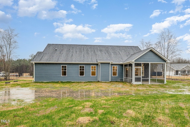 back of property featuring a sunroom