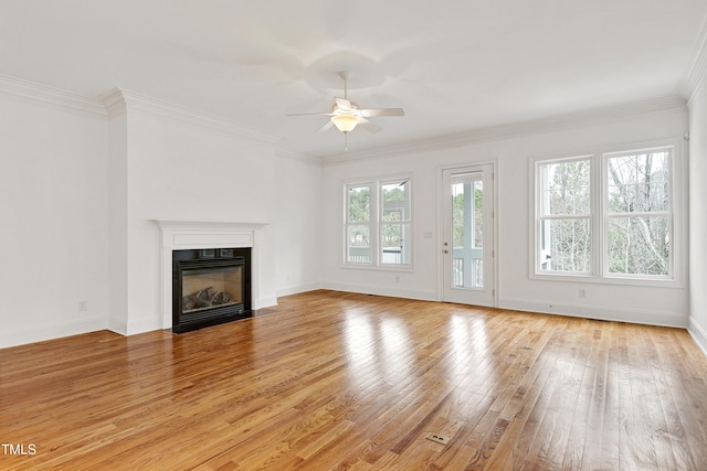 unfurnished living room featuring crown molding, light hardwood / wood-style flooring, and ceiling fan