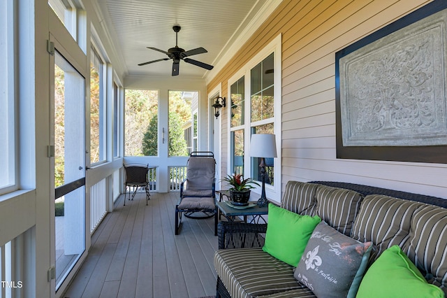 sunroom with a wealth of natural light and ceiling fan