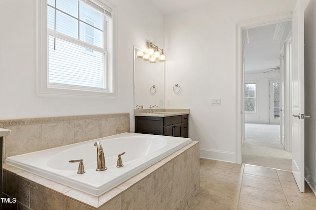 bathroom with vanity, tiled tub, and tile patterned floors