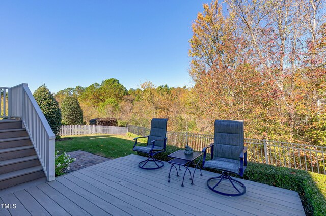 wooden deck with a yard