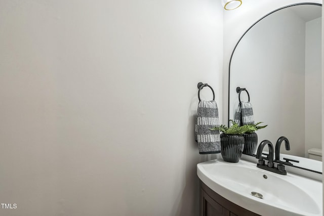 bathroom featuring sink and toilet