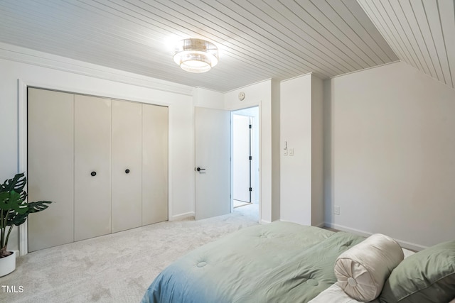 carpeted bedroom with wooden ceiling, lofted ceiling, and a closet