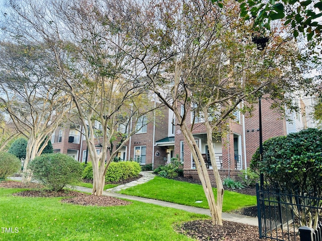 view of property's community with a yard