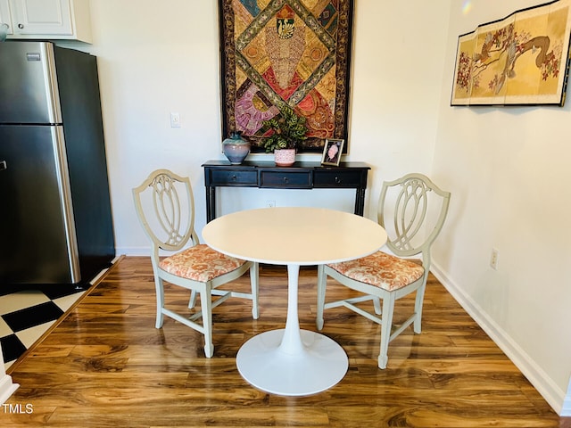 dining area with hardwood / wood-style floors