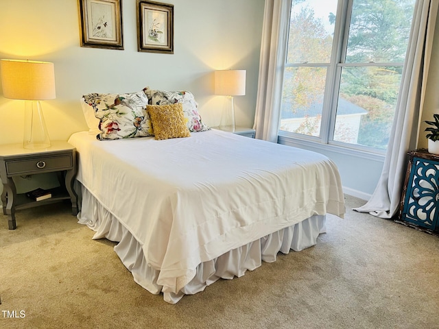 bedroom featuring light carpet