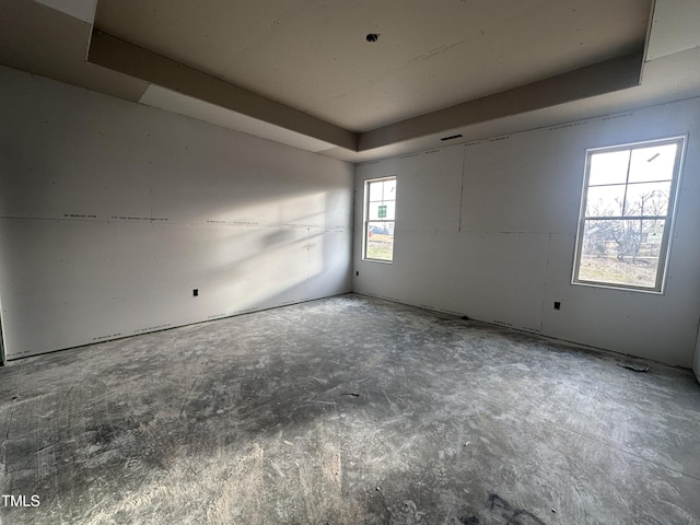 empty room featuring a tray ceiling