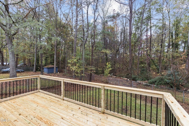 2704 Ross Rd, Durham, NC 27703 - deck with a storage unit, an outbuilding, and fence
