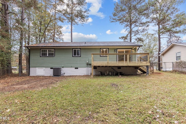 back of property featuring a yard, central AC, and a wooden deck