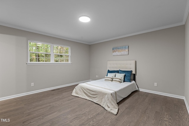 bedroom with dark wood-type flooring and ornamental molding