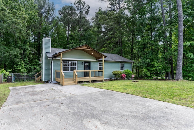 2704 Ross Rd, Durham, NC 27703 - view of front facade with a chimney, concrete driveway, crawl space, and a shingled roof