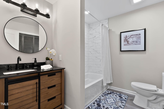 2704 Ross Rd, Durham, NC 27703 - full bathroom featuring baseboards, toilet, vanity, and shower / tub combo with curtain