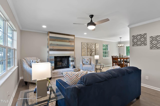 2704 Ross Rd, Durham, NC 27703 - living area featuring baseboards, crown molding, a large fireplace, a ceiling fan, and dark wood-type flooring