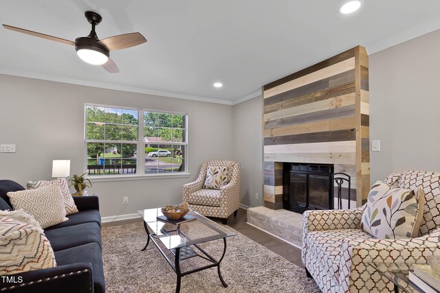2704 Ross Rd, Durham, NC 27703 - living area featuring crown molding, recessed lighting, a fireplace, a ceiling fan, and wood finished floors