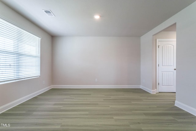 spare room featuring light hardwood / wood-style flooring