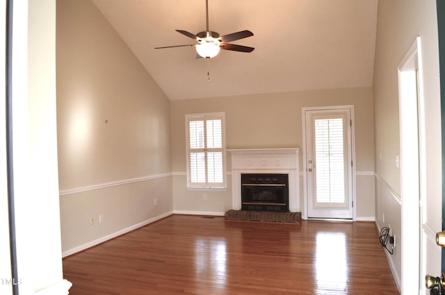 unfurnished living room featuring ceiling fan, a fireplace, high vaulted ceiling, and wood-type flooring