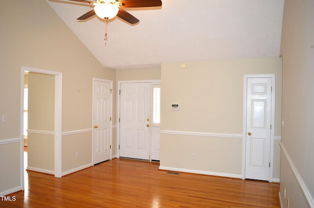 interior space featuring ceiling fan, high vaulted ceiling, and hardwood / wood-style flooring