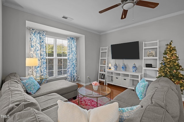 living room with hardwood / wood-style floors, ceiling fan, and crown molding