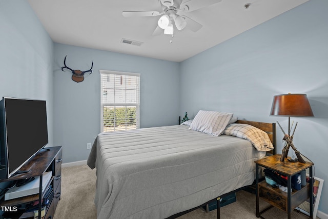 bedroom featuring ceiling fan and light colored carpet