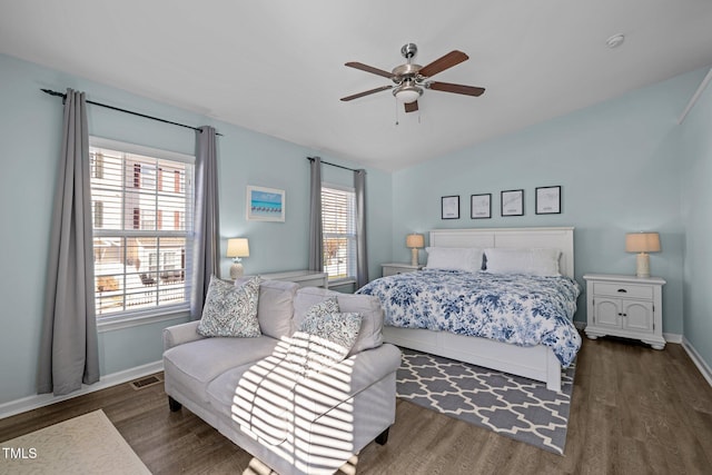 bedroom featuring dark hardwood / wood-style flooring and ceiling fan