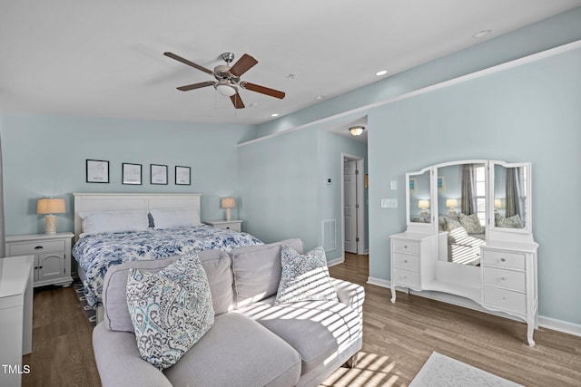 bedroom featuring ceiling fan, wood-type flooring, and vaulted ceiling