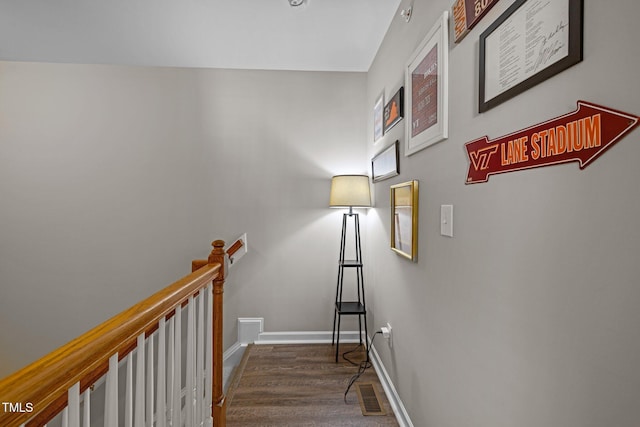 stairs with wood-type flooring