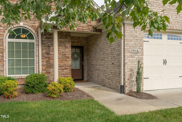 entrance to property featuring a garage