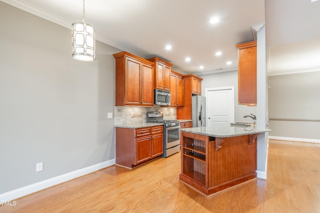 kitchen with light stone counters, kitchen peninsula, light hardwood / wood-style floors, a kitchen bar, and appliances with stainless steel finishes